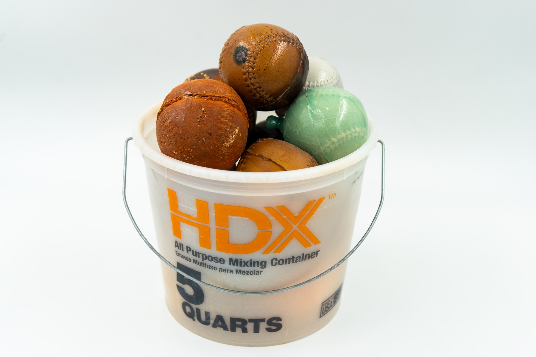 Objects — bucket of ceramic baseballs